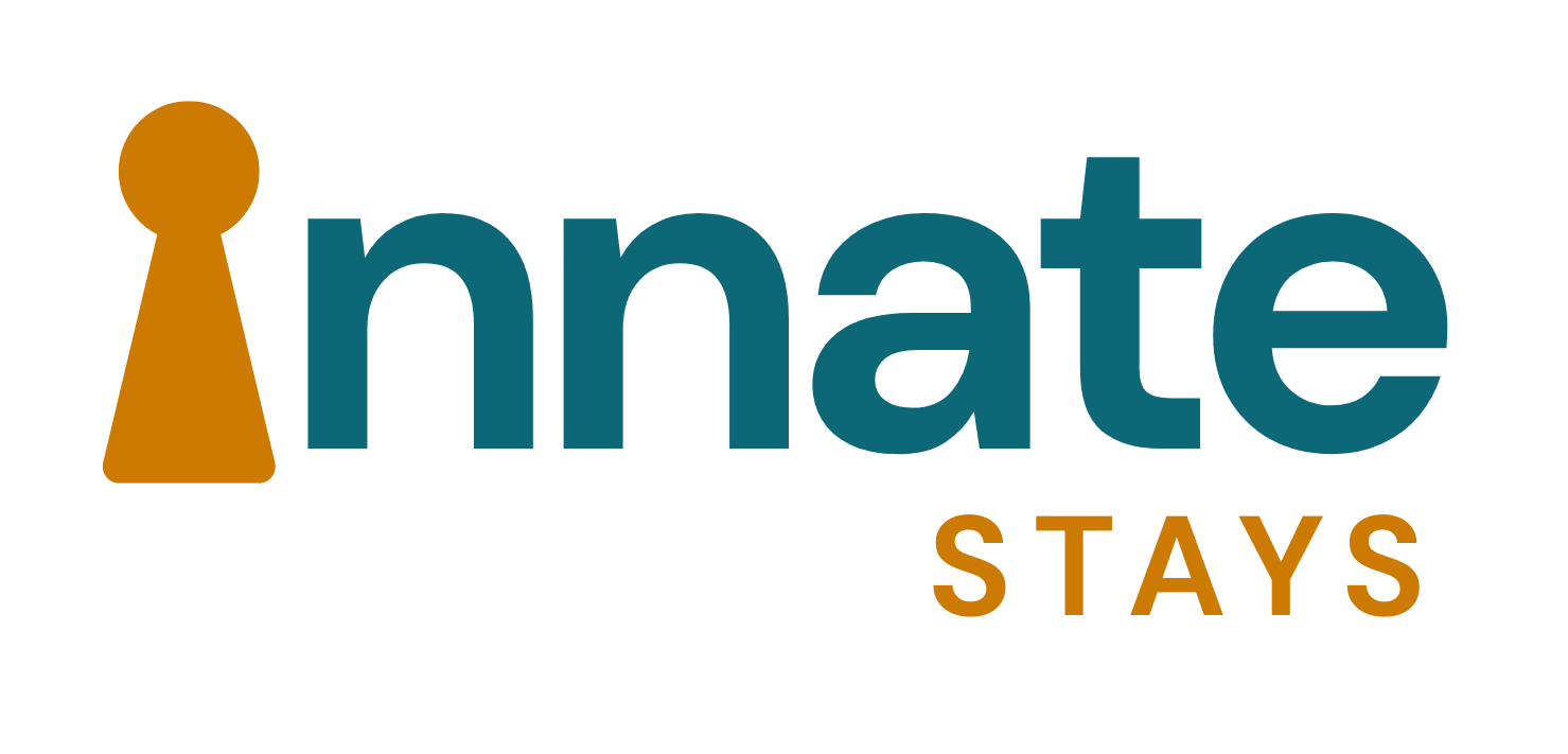 Innate Stays logo. Orange keyhole shape used as I of Innate with the rest of the word in dark blue small case letters. Stays in capital letters underneath in green and to the right.